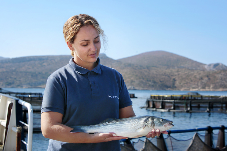 KITO team member holding fish
